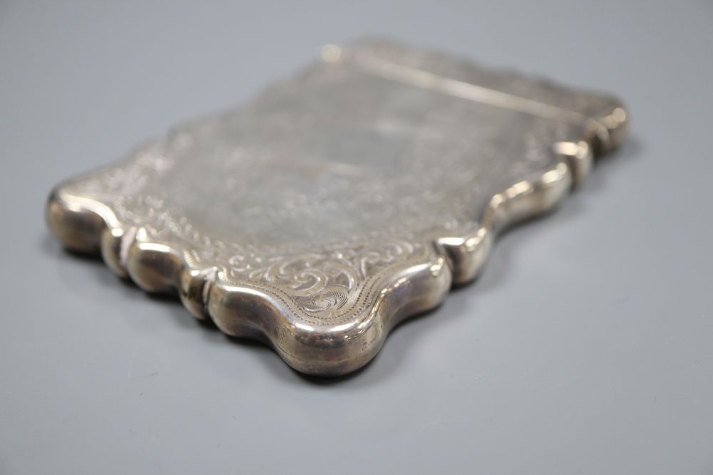 An Edwardian engraved silver card case, Birmingham, 1909, 94mm.